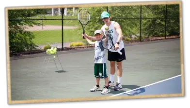 Campers playing tennis at Trails End Camp in Beach Lake, PA