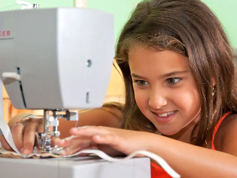 camper focused on sewing at Trails End Camp