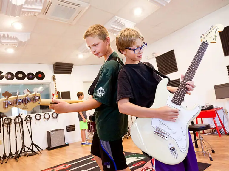 Campers playing guitar at Trails End Camp